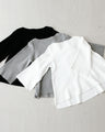 For winter to spring coordination: A knit cut-off sleeve top for adults that can be worn across the seasons