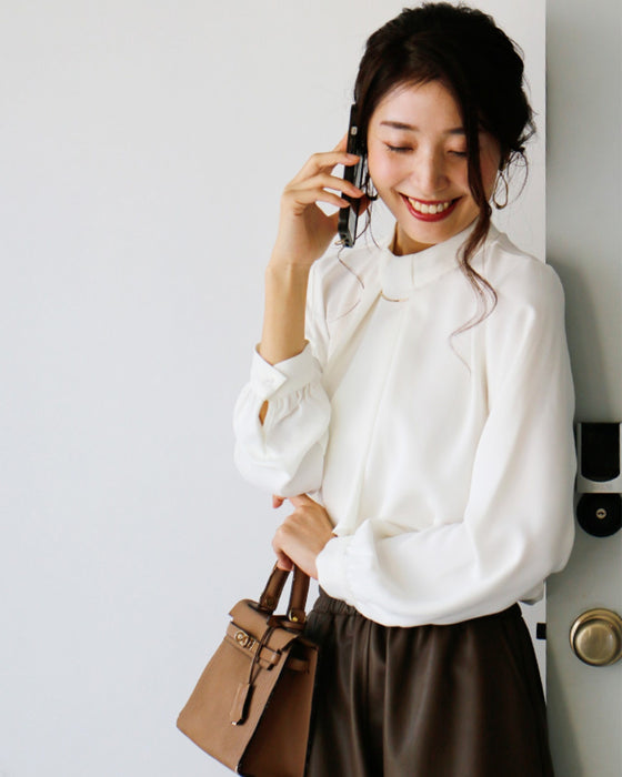 No need to tie it. Just put it on and you're done! Bowtie blouse