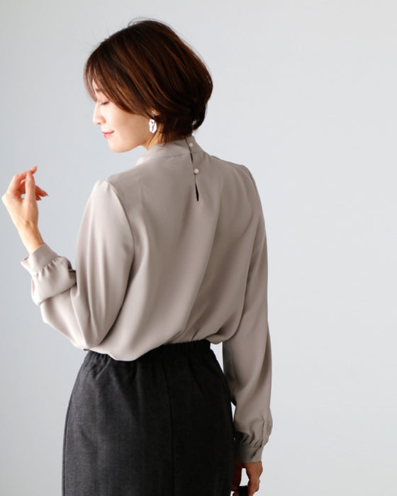 No need to tie it. Just put it on and you're done! Bowtie blouse