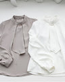 No need to tie it. Just put it on and you're done! Bowtie blouse