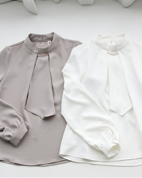 No need to tie it. Just put it on and you're done! Bowtie blouse