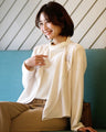 A beautifully draped chiffon collar cardigan that can be worn until early summer