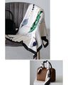 An elegant and sophisticated silk-touch scarf for adults