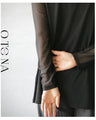Be it the main piece or layered. Create an atmosphere with just one piece! Sheer top in black