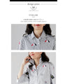 A casual and playful look. Striped and embroidered shirt. 