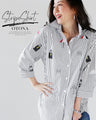 A casual and playful look. Striped and embroidered shirt. 