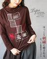 Warm fleece-lined top with a heartwarming embroidery.
