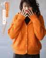 Make your mood happy with this vitamin-colored knit hoodie in orange