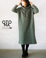 A quilted-style parka dress with distinctive stitching lines