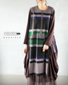 A collaboration dress with a check pattern and a unique design that stands out from the crowd