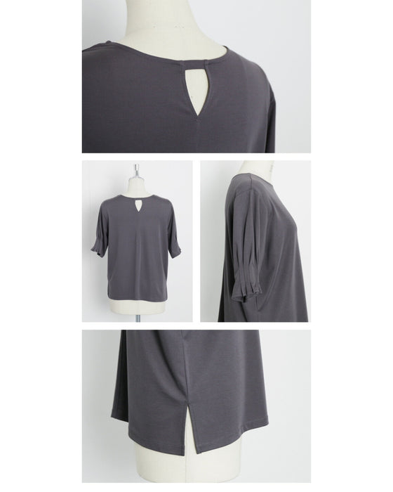 A sophisticated adult top with tucked sleeves