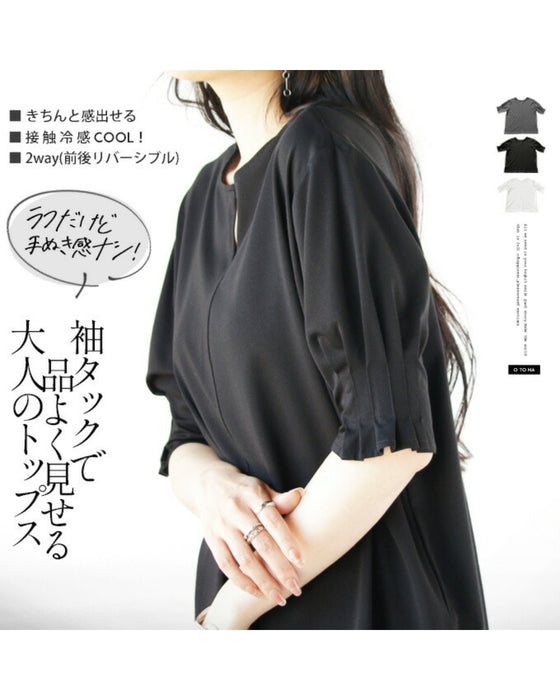 A sophisticated adult top with tucked sleeves