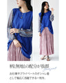 A tunic blouse with sheer striped sleeves that stands out from the crowd