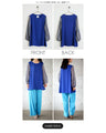 A tunic blouse with sheer striped sleeves that stands out from the crowd