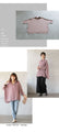 A loose dolman blouse for adults in dull pink