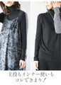 A versatile knit that can be worn both front and back for a slimming look