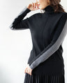 A versatile knit that can be worn both front and back for a slimming look