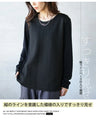 A top made of different materials with a embossed pattern