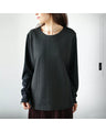 A top made of different materials with a embossed pattern