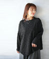 A unique black top with ruffled shirring and irregular hem