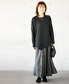 A unique black top with ruffled shirring and irregular hem
