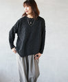 A unique black top with ruffled shirring and irregular hem
