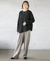 A unique black top with ruffled shirring and irregular hem