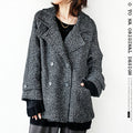 A monotone tweed coat that goes well with any style
