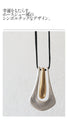 A large motif suede string long necklace that looks great on a daily basis