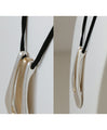 A large motif suede string long necklace that looks great on a daily basis