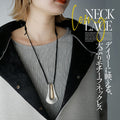 A large motif suede string long necklace that looks great on a daily basis