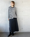 Stylish logo for adults. Asymmetrical knitwear