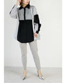 A one-piece look. A shirt with a combination of different materials