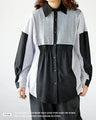 A one-piece look. A shirt with a combination of different materials