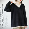 A layered ribbed knit hoodie that peeks out for a stylish look