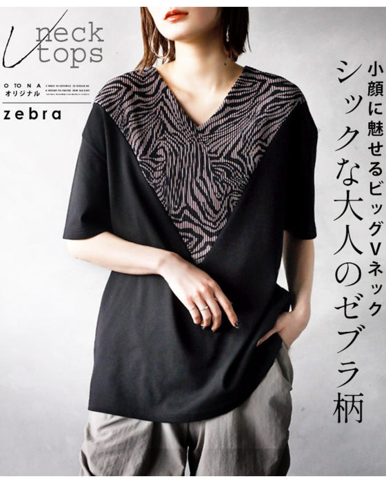 A chic adult zebra print top with a big V-neck that makes your face look smaller