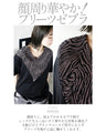 A chic adult zebra print top with a big V-neck that makes your face look smaller
