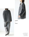 A textured knit top with lace ribbon for a mature and cute look