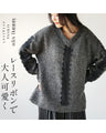 A textured knit top with lace ribbon for a mature and cute look