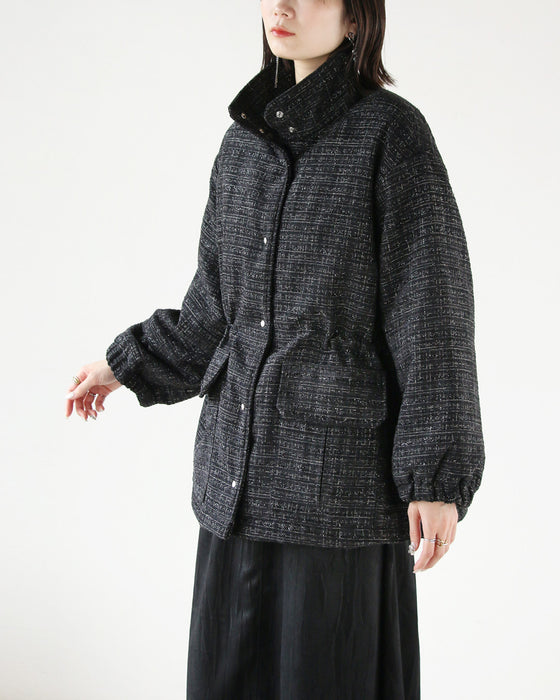 A classy coat made of sparkling tweed