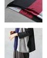 A two-tone, slimming knit top for a sophisticated look