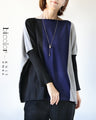 A two-tone, slimming knit top for a sophisticated look