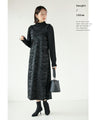 A faux leather jumper skirt with a texture that will charm adults