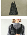 A faux leather jumper skirt with a texture that will charm adults