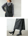 A faux leather jumper skirt with a texture that will charm adults