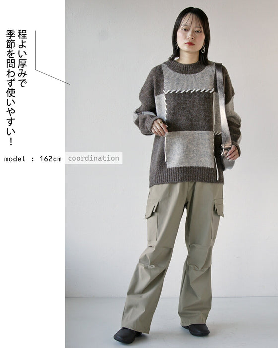 The key is the tucks. Versatile cargo pants in beige