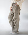 The key is the tucks. Versatile cargo pants in beige