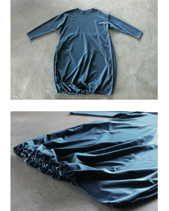 深みブルーが映える計算されたバルーンワンピース