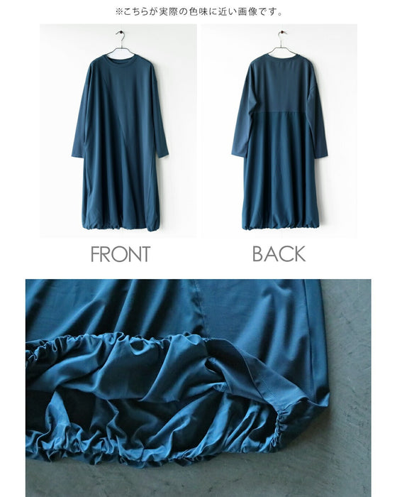 深みブルーが映える計算されたバルーンワンピース