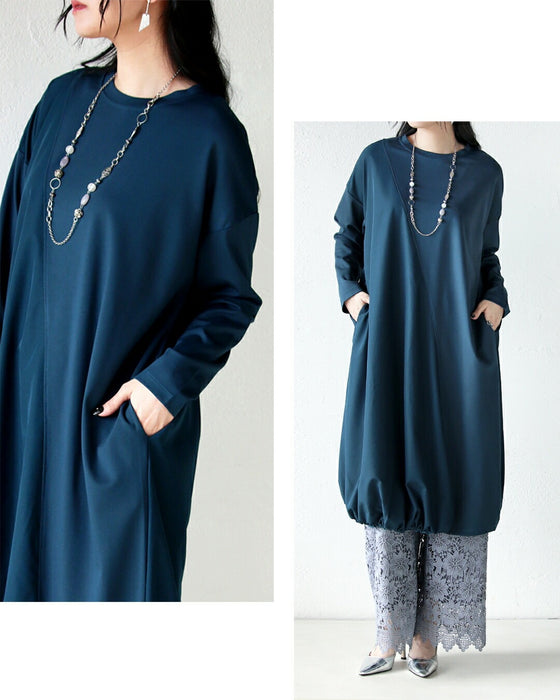 深みブルーが映える計算されたバルーンワンピース